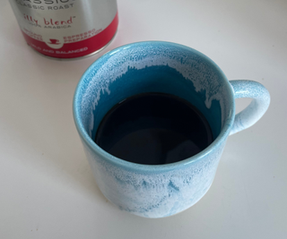 AeroPress Premium black coffee in a mug