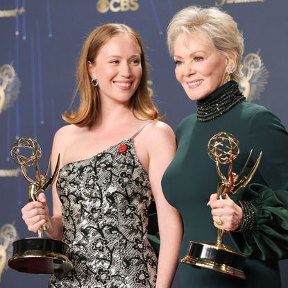 hacks stars hannah einbinder and jean smart pose together with their awards at the 2025 emmys