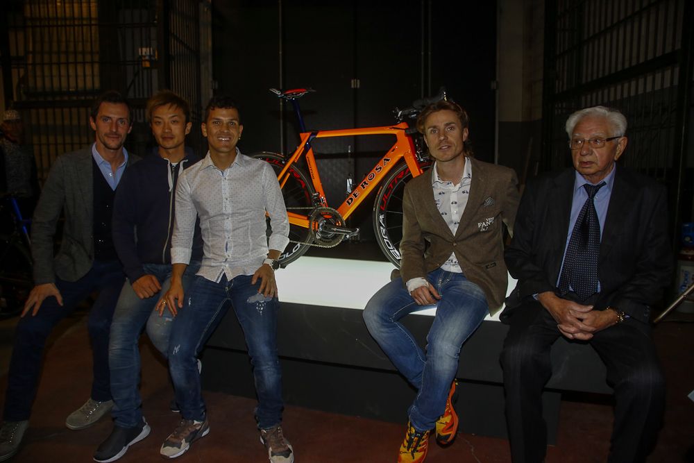 Nippo - Vini Fantini riders relax near one of their 2017 De Rosa team bikes.