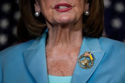 Nancy Pelosi wearing an American and Ukrainian flag pin