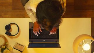 A woman typing on her computer in "Sweet Bobby: My Catfish Nightmare" on Netflix