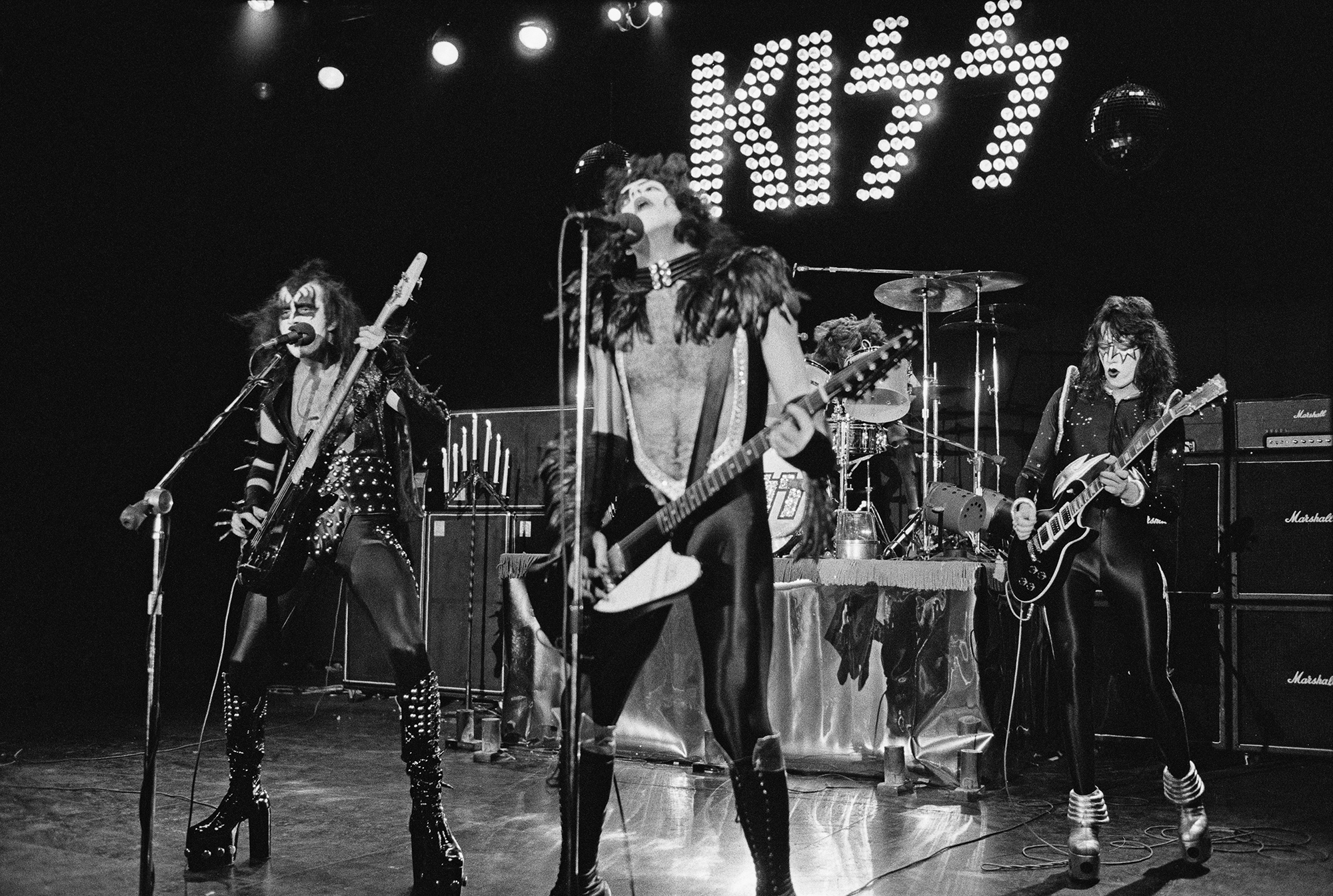 American rock group Kiss perform live on stage at Cobo Hall in Detroit during the concert recording of Alive! on 16th May 1975. Left to right: Gene Simmons, Paul Stanley, Peter Criss and Ace Frehley.