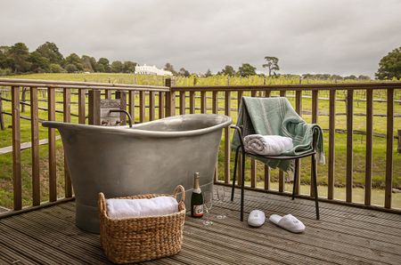 Outdoor bathtub outside a guest room at Lympstone Manor.
