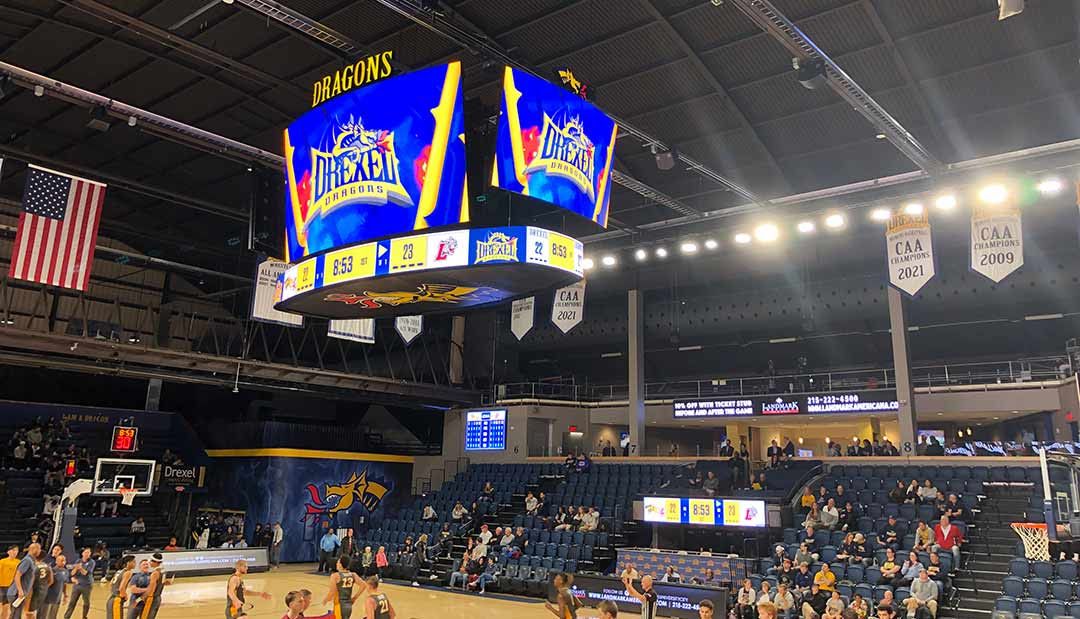 A new 900-square-foot Daktronics centerhung display shows the score and graphics during a Drexel college basketball game. 