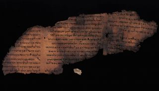 The Great Psalms Scroll seen next to the newfound fragment containing Psalm 147:1.