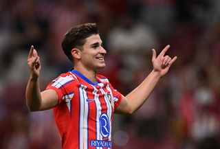 Julian Alvarez of Atletico Madrid celebrates scoring Atletico's third goal during the LaLiga match between Atletico de Madrid and Valencia CF at Estadio Civitas Metropolitano on September 15, 2024 in Madrid, Spain.