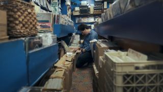 Chris Wilcha thumbing through records in Flipside