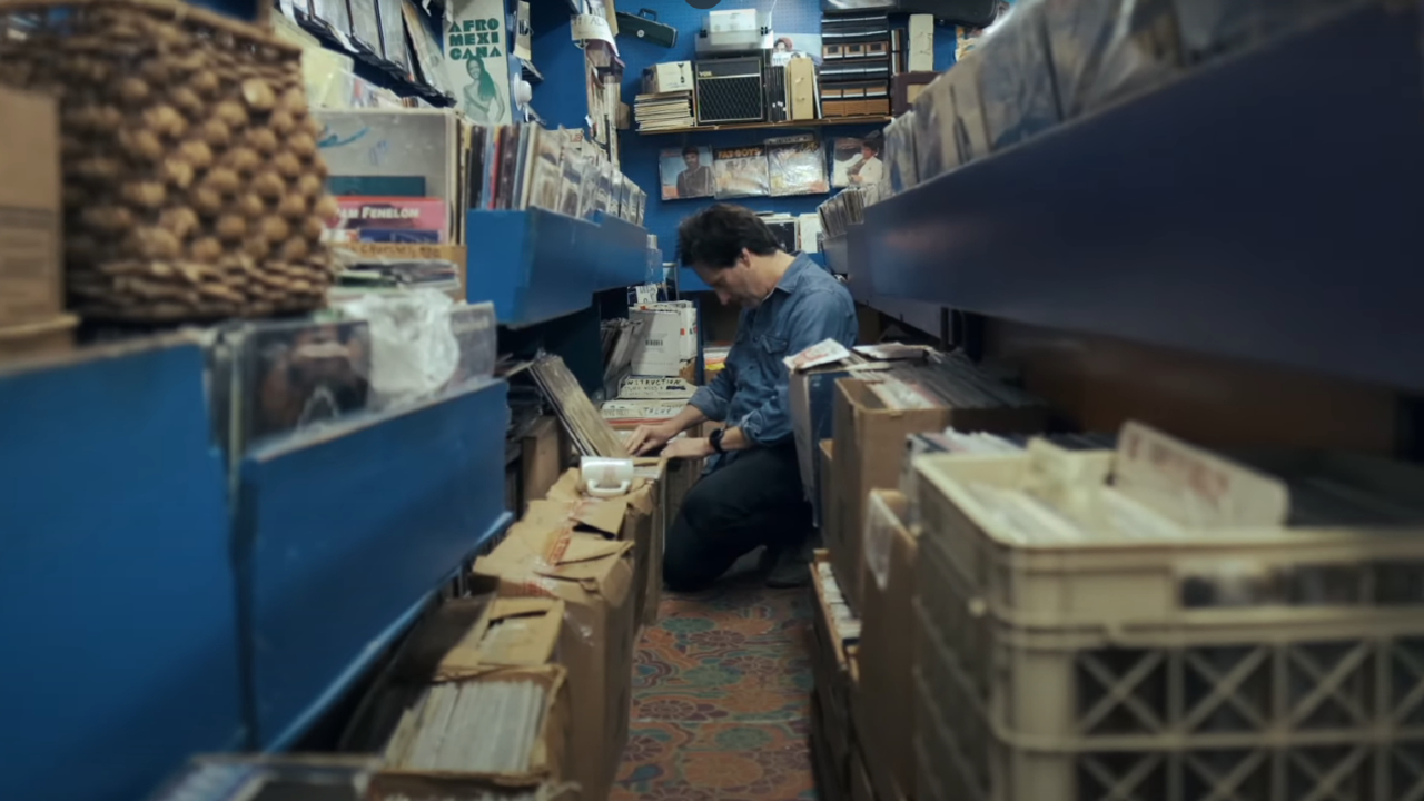 Chris Wilcha thumbing through records in Flipside