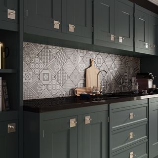 kitchen room with printed tiled walls and black kitchen cabinets