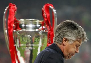 Milan's coach Carlo Ancelotti walks by the throphy at the end of the UEFA Champions league football final AC Milan vs Liverpool, 25 May 2005 at the Ataturk Stadium in Istanbul. Liverpool won 3-2 on penalties. 