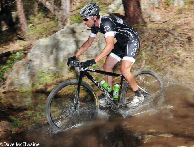 A Cannondale racer rides through one of several water crossings