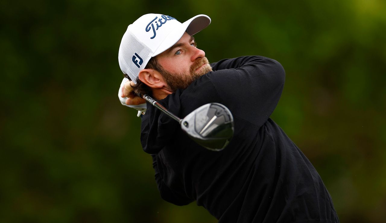 Cameron Young strikes a fairway wood