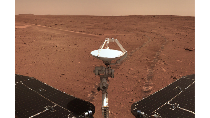 The Zhurong rover looks back on tracks it has left on the surface of Mars.