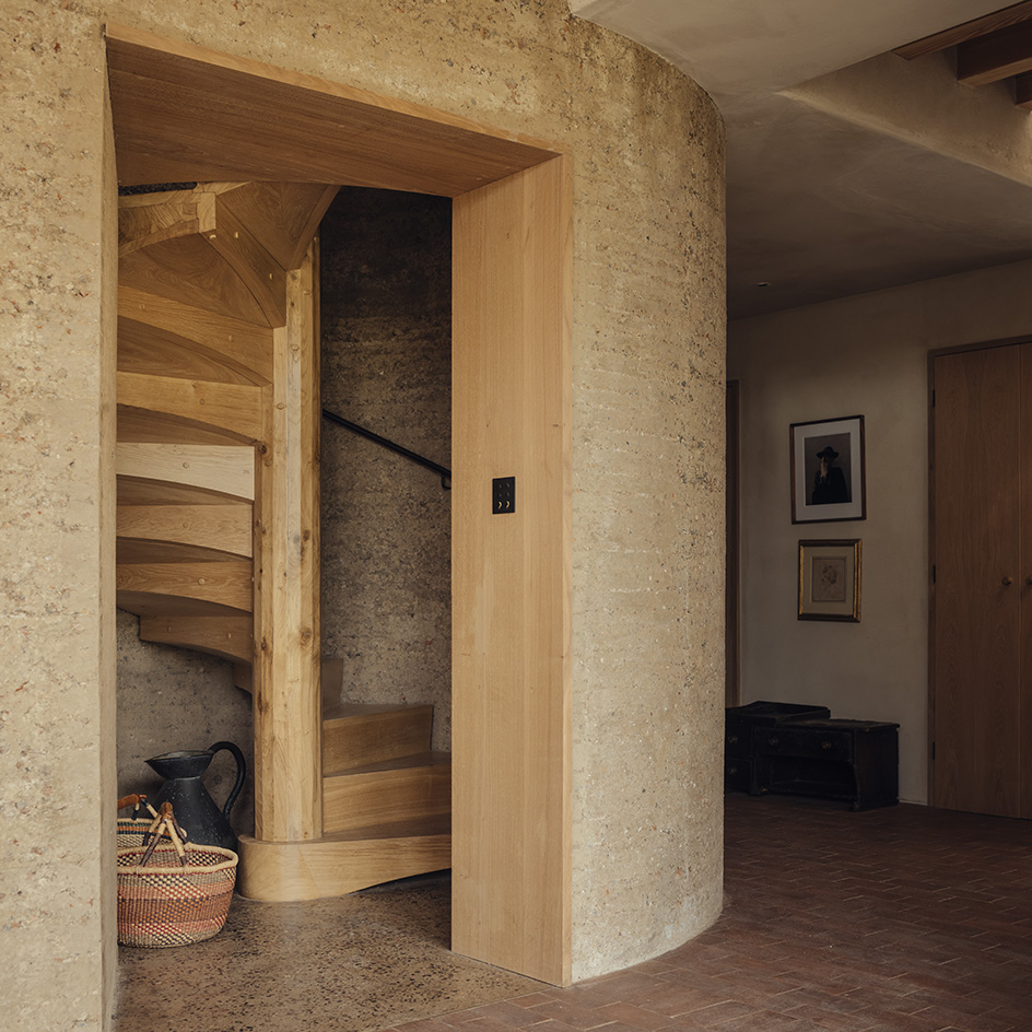 view of Rammed Earth House by Tuckey Design Studio with tactile walls and earth tones