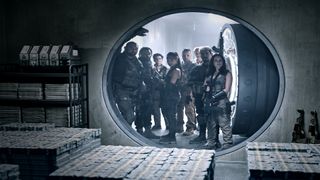 Army of the Dead's cast look at a vault of money in Zack Snyder's zombie heist movie