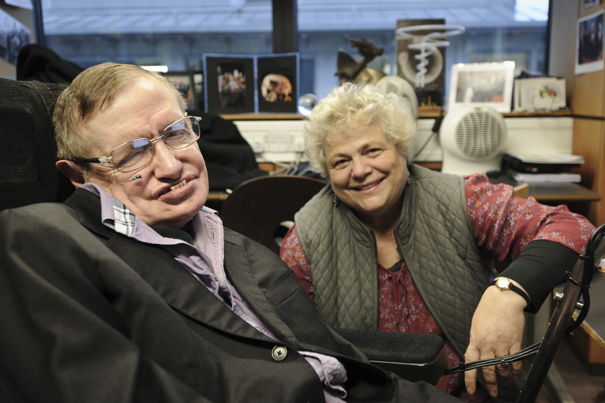 Stephen Hawking and his assistant Judith Croasdell pose for a portrait in his office at the Department of Applied Mathematics and Theoretical Physics, Cambridge. Hawking is the subject of the PBS documentary &quot;Hawking&quot; airing Jan. 29, 2014.