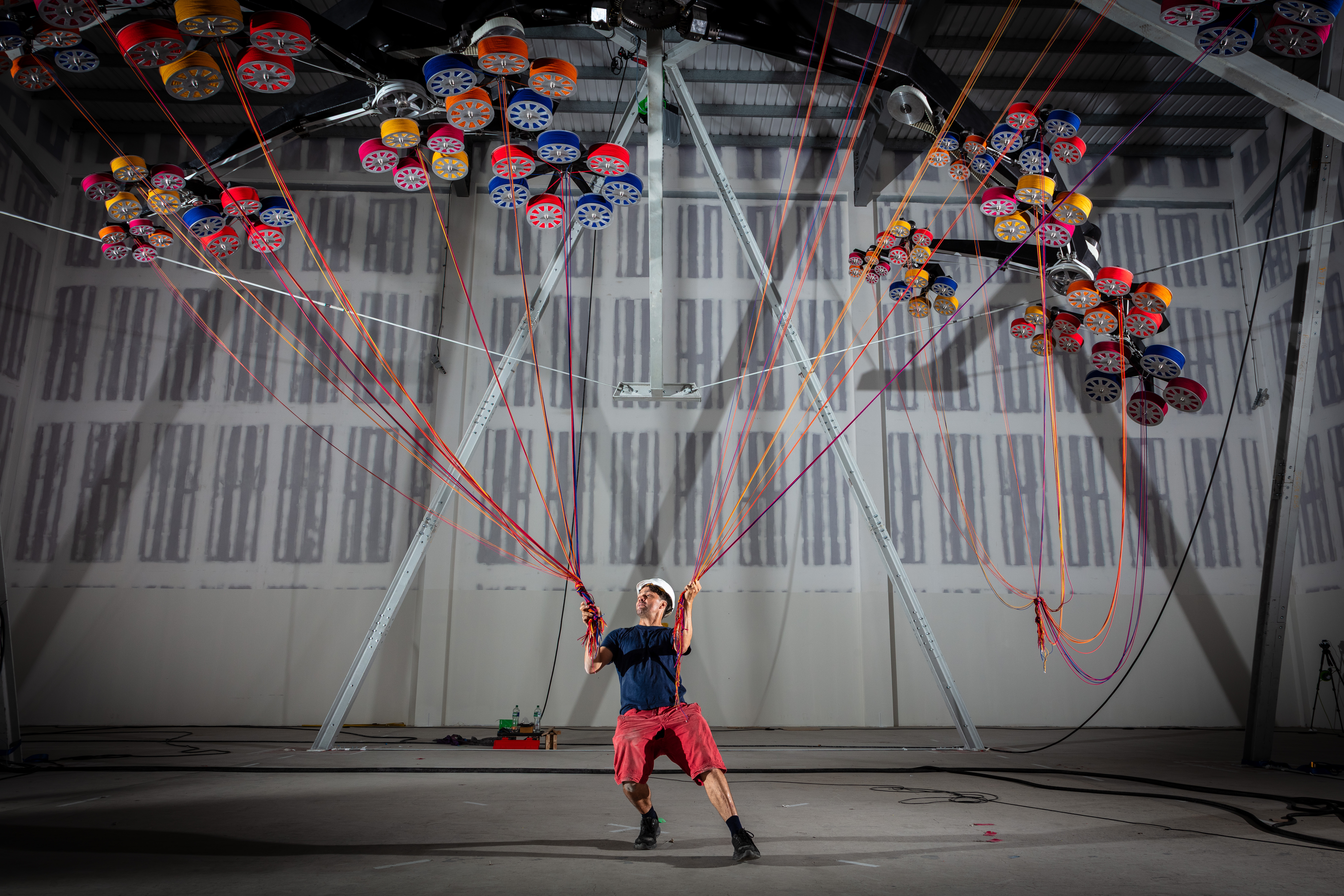 man pulling ropes