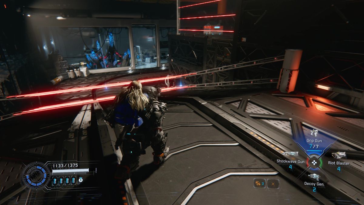 Pragmata blue crystals: A player dodging lasers on a ramp, trying to reach a lab.