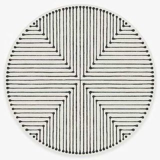 A black and white round rug
