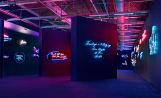 Emin's archive of chaotically scrawled and spelt slogans - in a lofty blacked-out space - read like illuminated scribblings on a toilet wall.