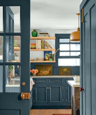 kitchen with dark blue cabinets and doors