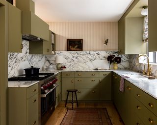 kitchens without islands with green cabinets and stone countertop