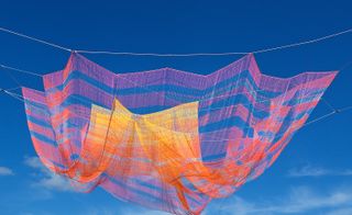 Monumental work, made of 35 miles of technical fibres crafted into 242,800 knots, floats as a multicoloured cloud