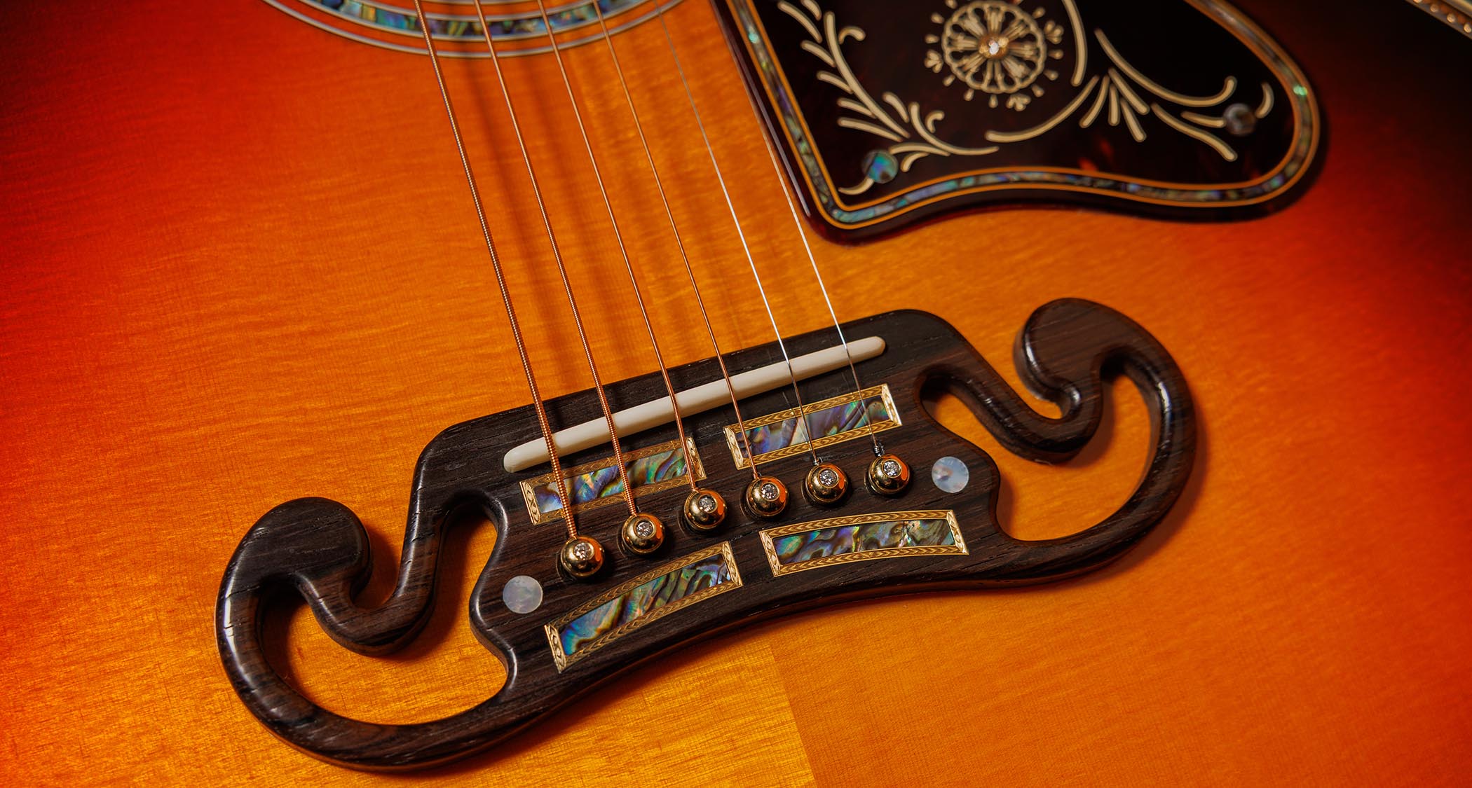 Gibson Custom SJ-200 Monarch #100: this stunning one-of-one jumbo is replete with all kinds of rococo flourishes, from the diamond and gold crown inlay on the headstock, to the 14k gold rope binding, Gibson calls it the &quot;ultimate custom&quot; acoustic and not without some justification.