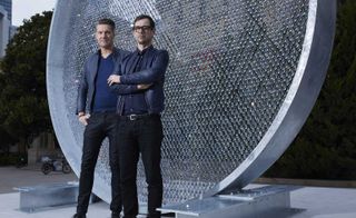 Designers Ian Stallard and Patrik Fredikson in front of the glimmering 'Prologue' for Swarovski