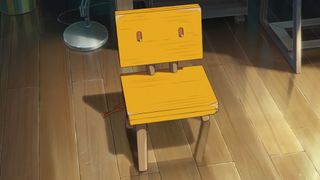 A chair stands alone in a still from anime Suzume