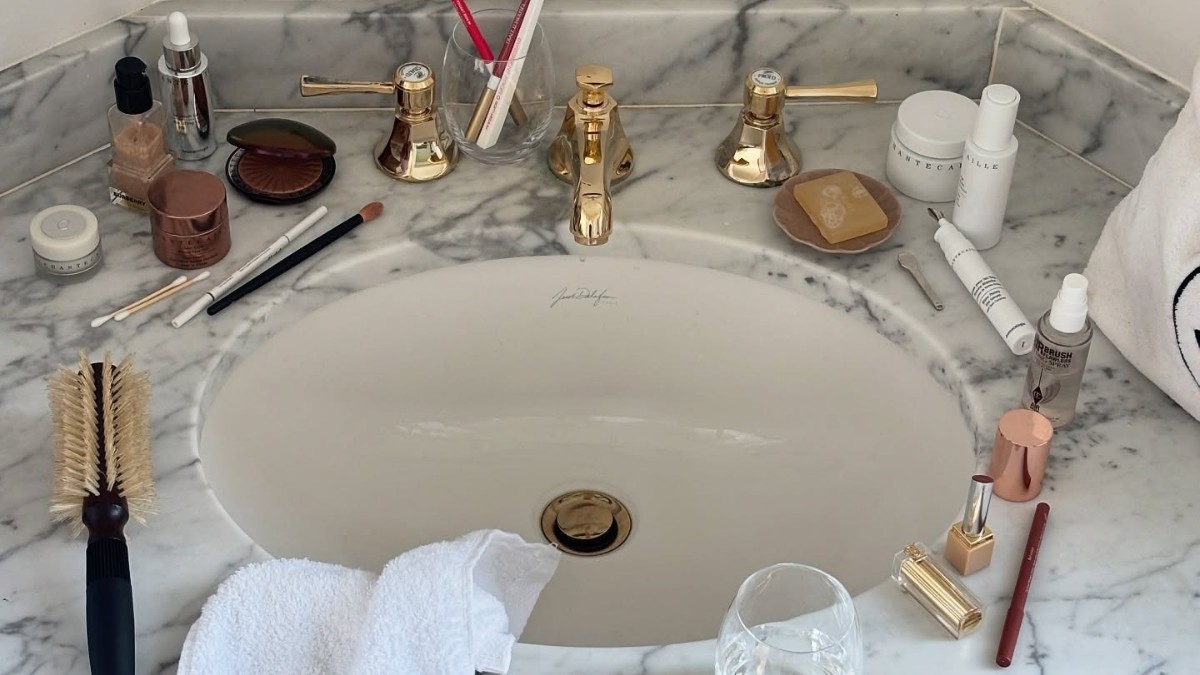 Photo of beauty products scattered on a sink