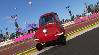 Forza Horizon 6: A palyer driving with a tiny red car around the Horizon Festival grounds.