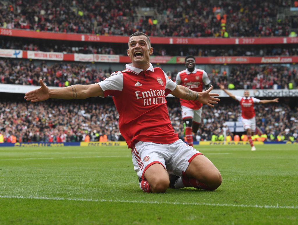 Granit Xhaka celebrates scoring the 3rd Arsenal goal during the Premier League match between Arsenal FC and Tottenham Hotspur at Emirates Stadium on October 01, 2022 in London, England.