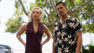 Perdita Weeks as Juliet Higgins and Jay Hernandez as Thomas Magnum standing next to each other in Magnum P.I. 