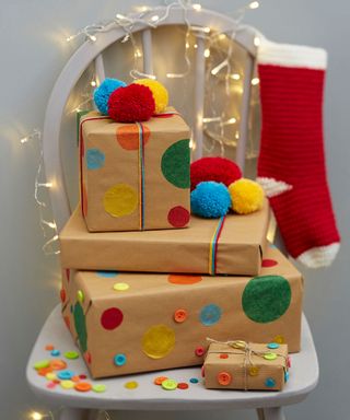 Brown paper wrapped presents with colourful button decorations