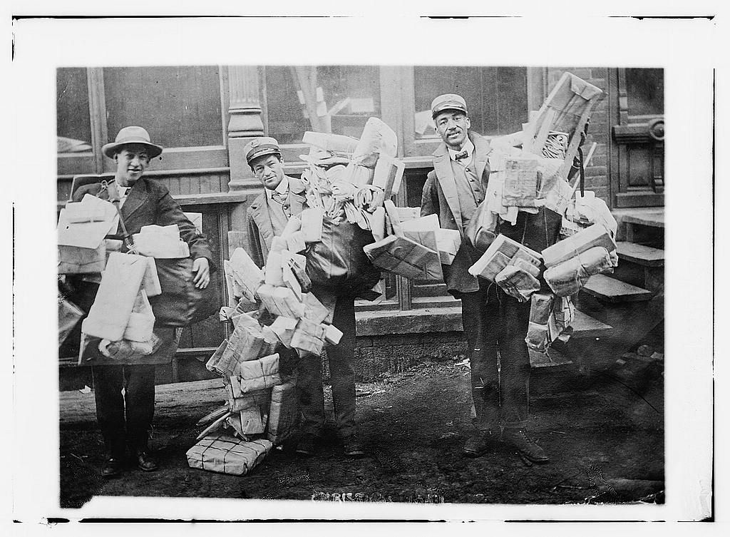 Mailmen delivering Christmas presents. 