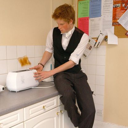 Prince Harry toasting a slice of bread