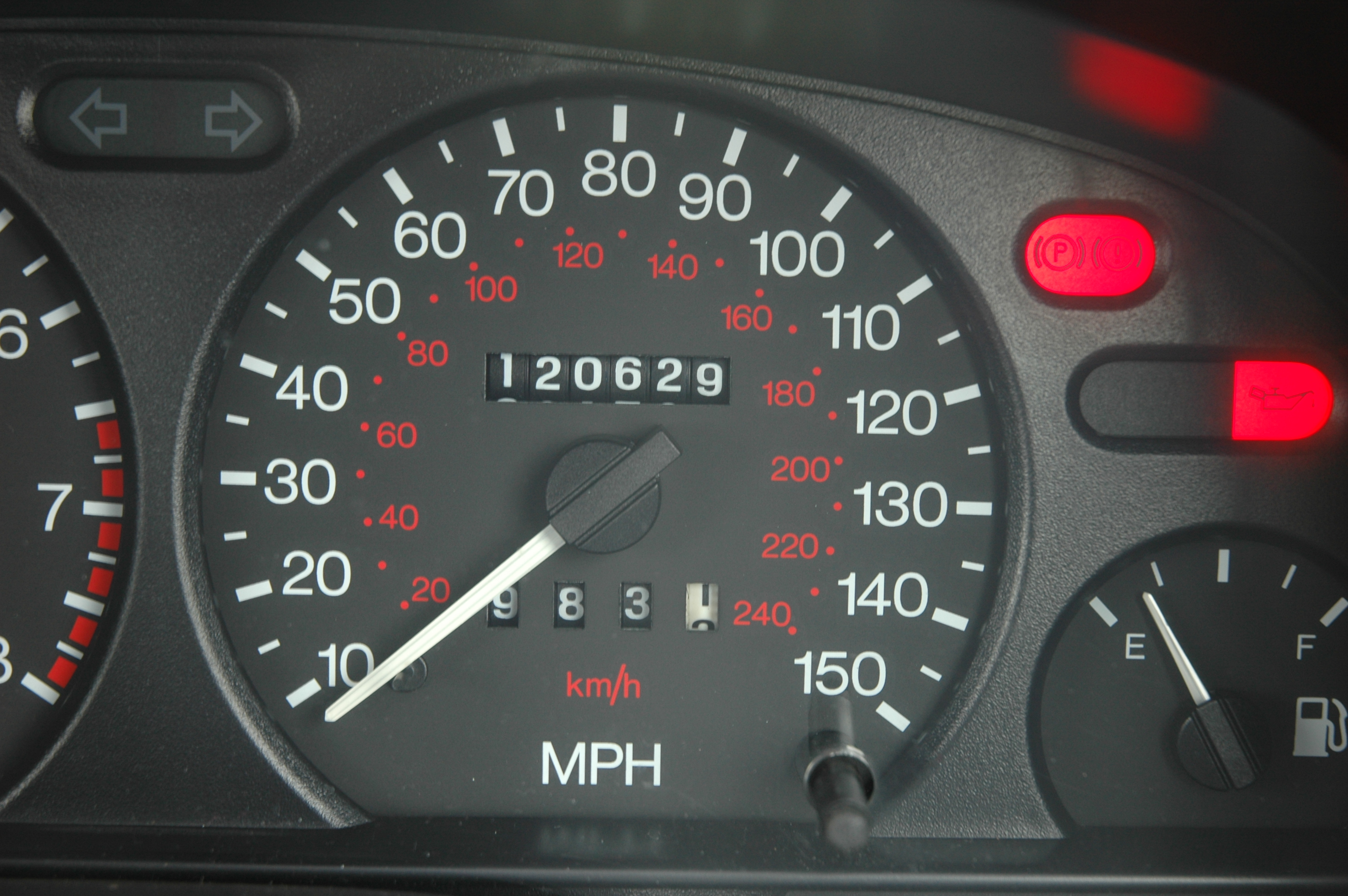 A car's odometer reading 120,000 miles.