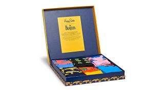 A Six-Pack Of Beatles Socks Featuring Iconic Yellow Submarine Art