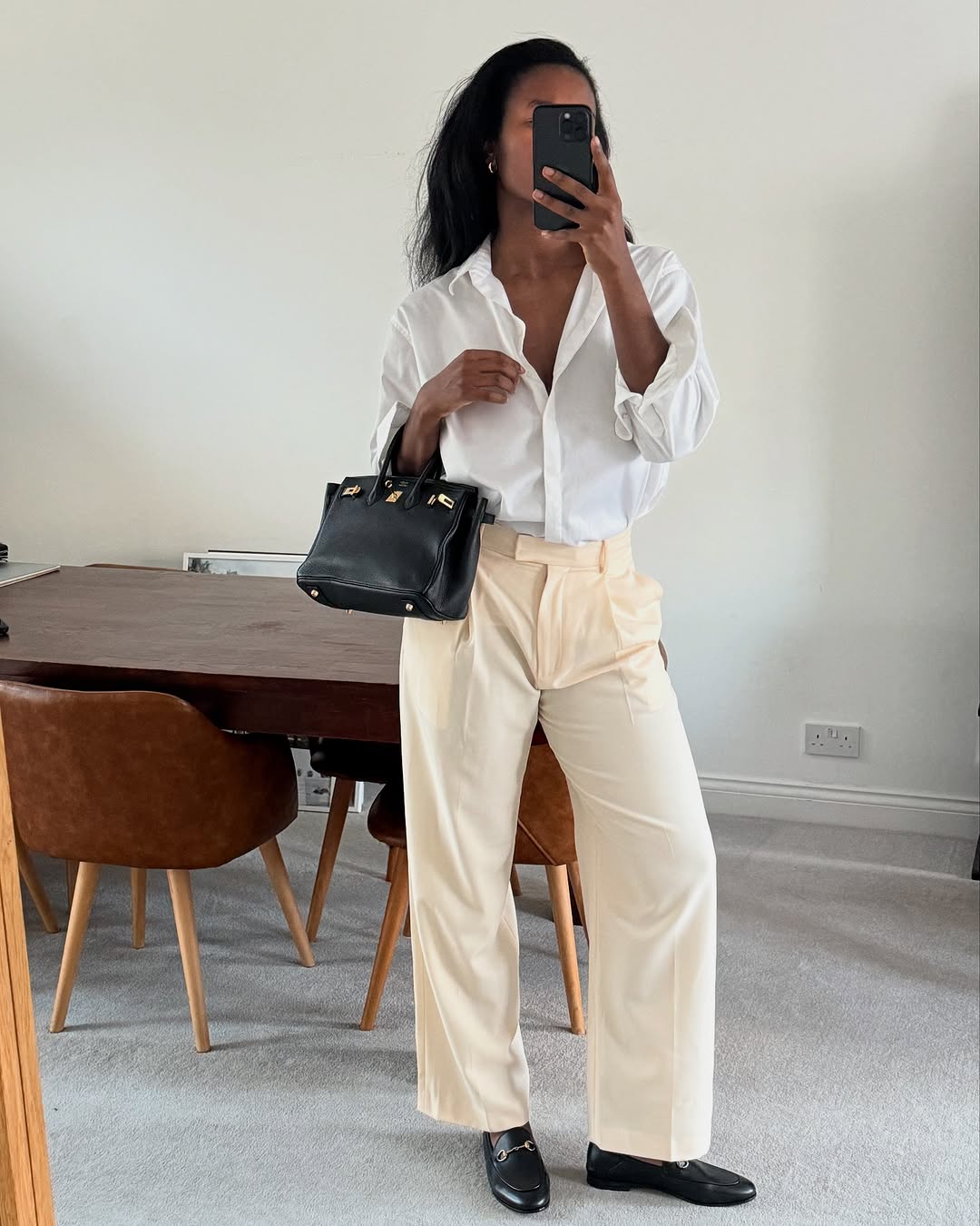 Woman wearing popular anti trend wardrobe items 2026.