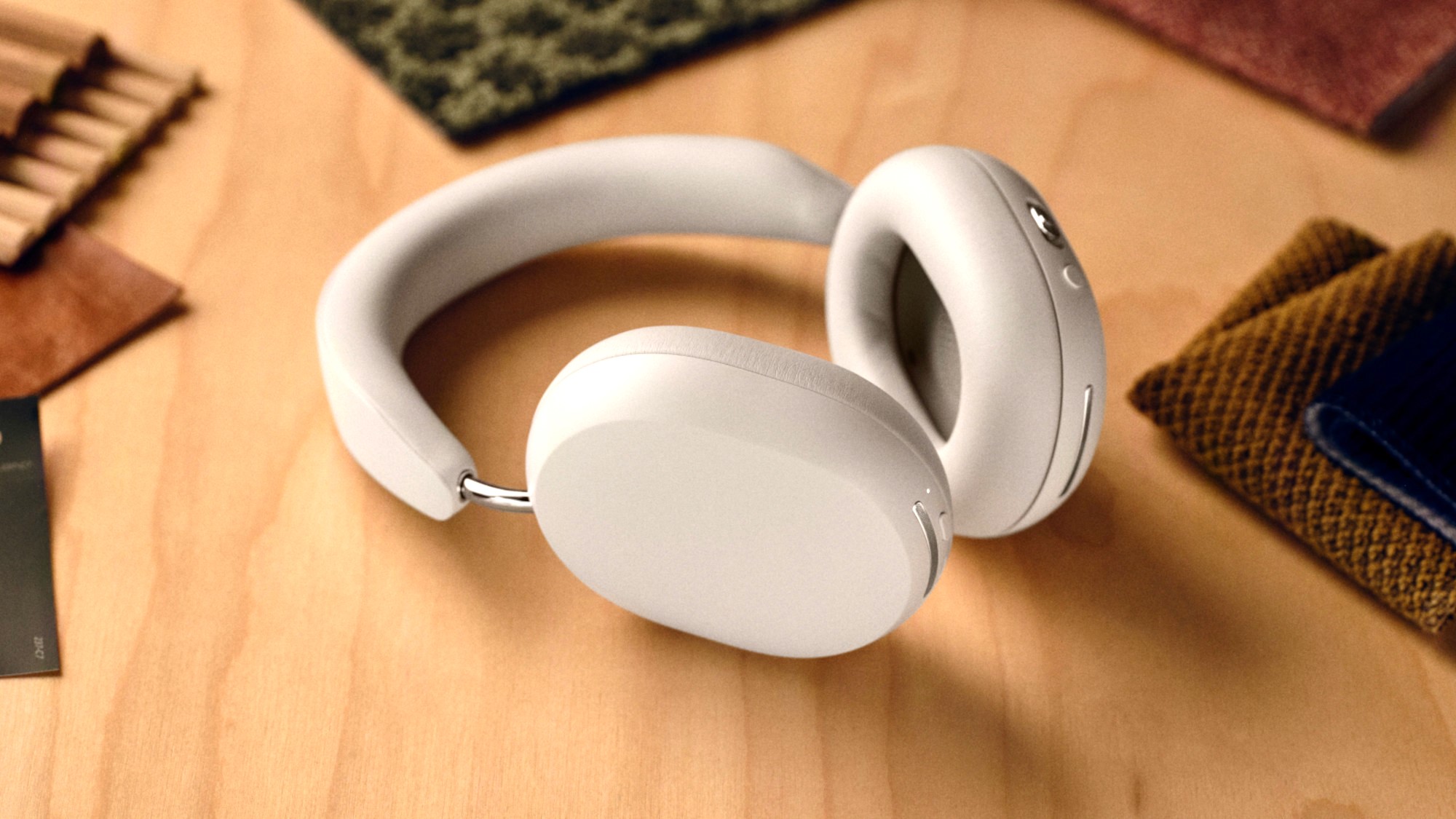 Sonos Ace headphones in white on a desk