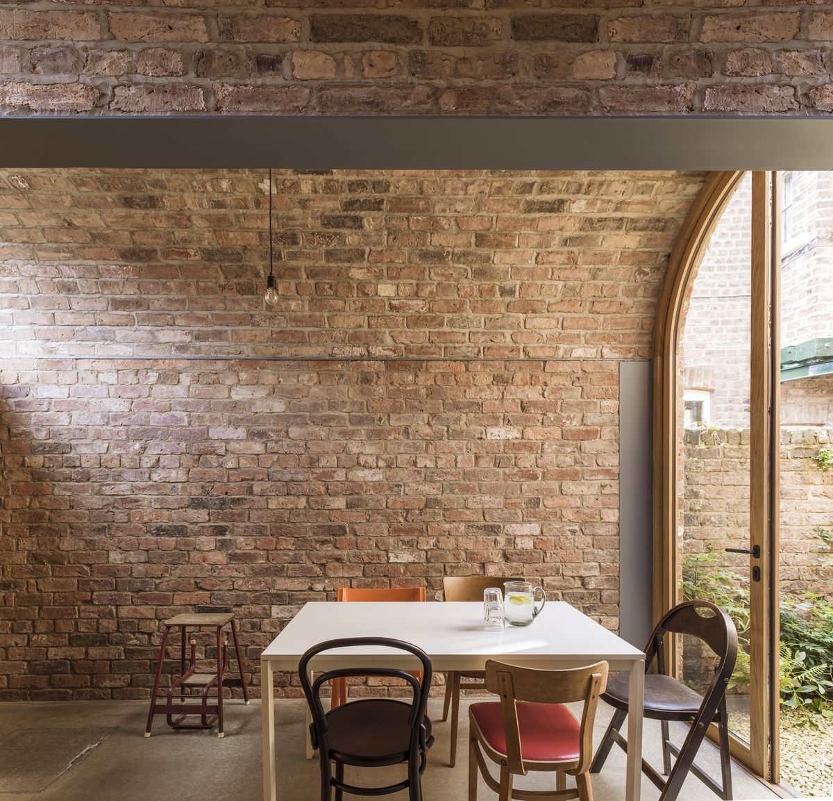 brick barrel vaulted ceiling above dining space