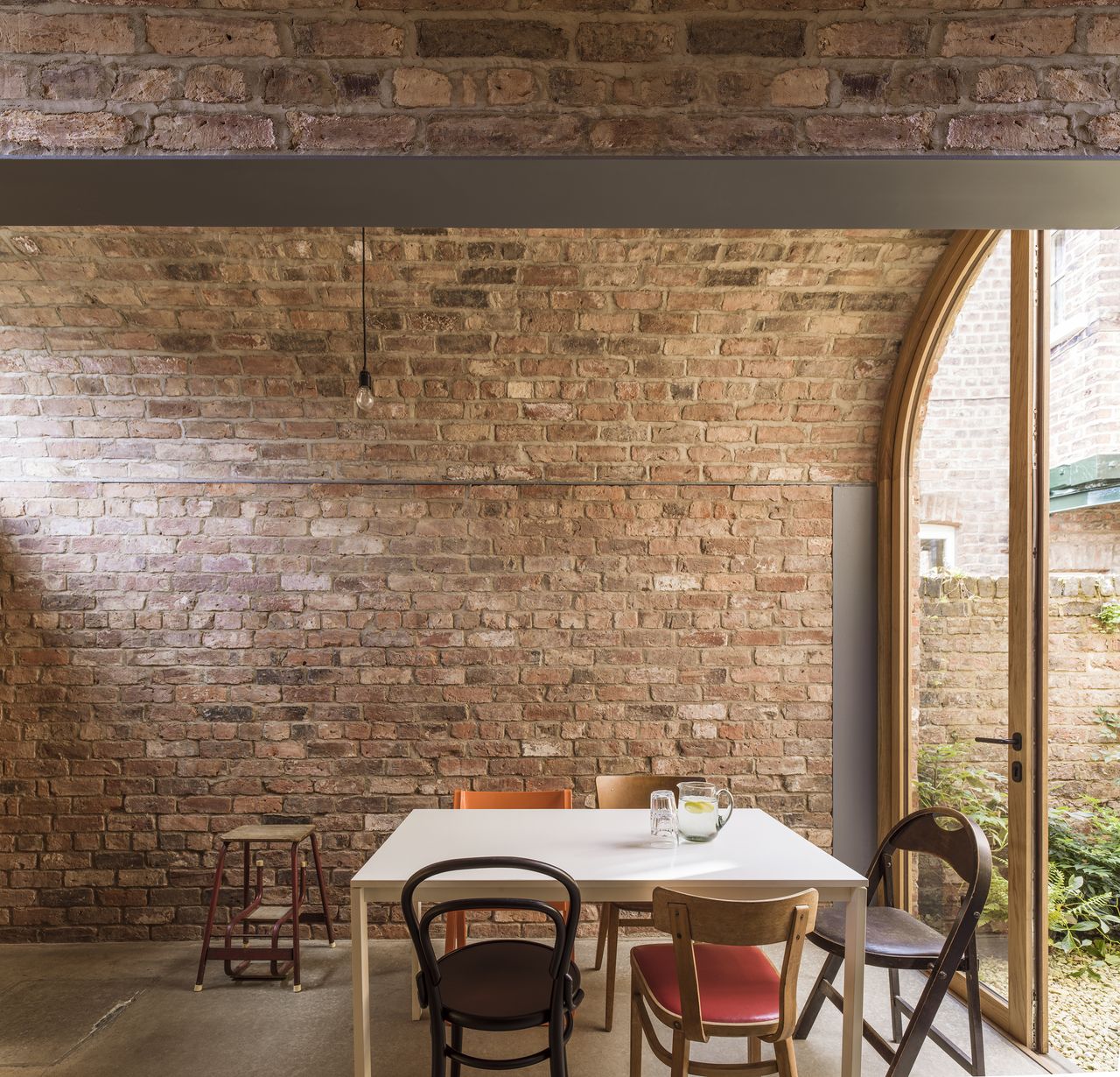 brick barrel vaulted ceiling above dining space