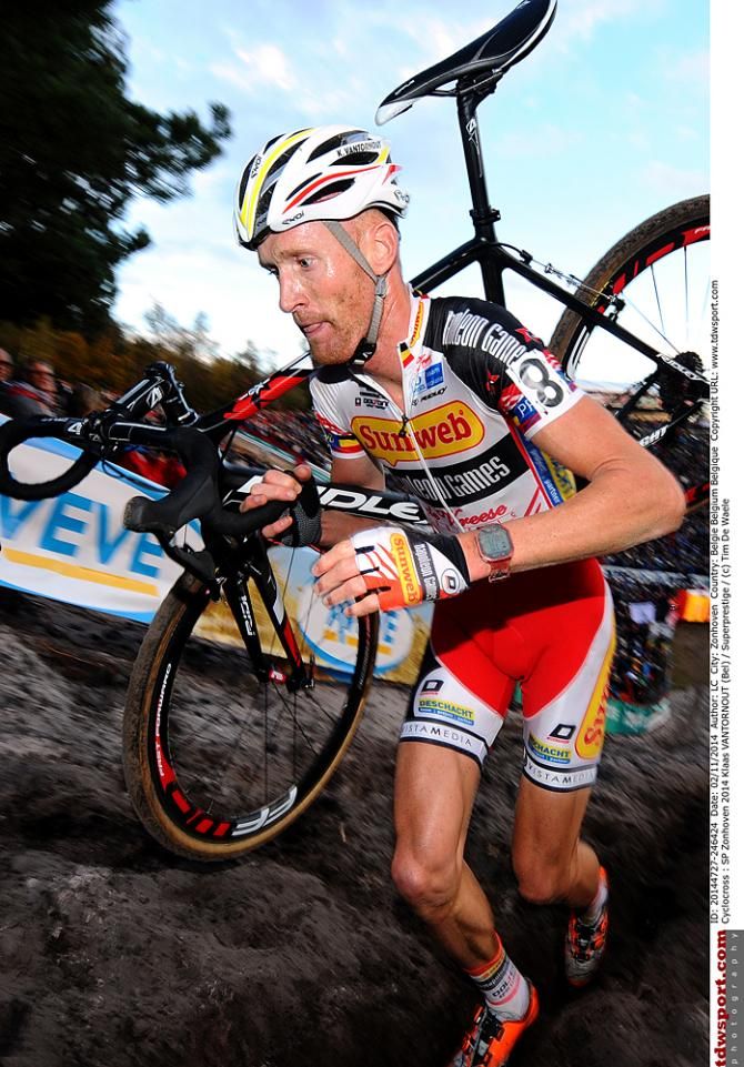 Kevin Pauwels (Sunweb - Napoleon Games) carries his bike up the climb