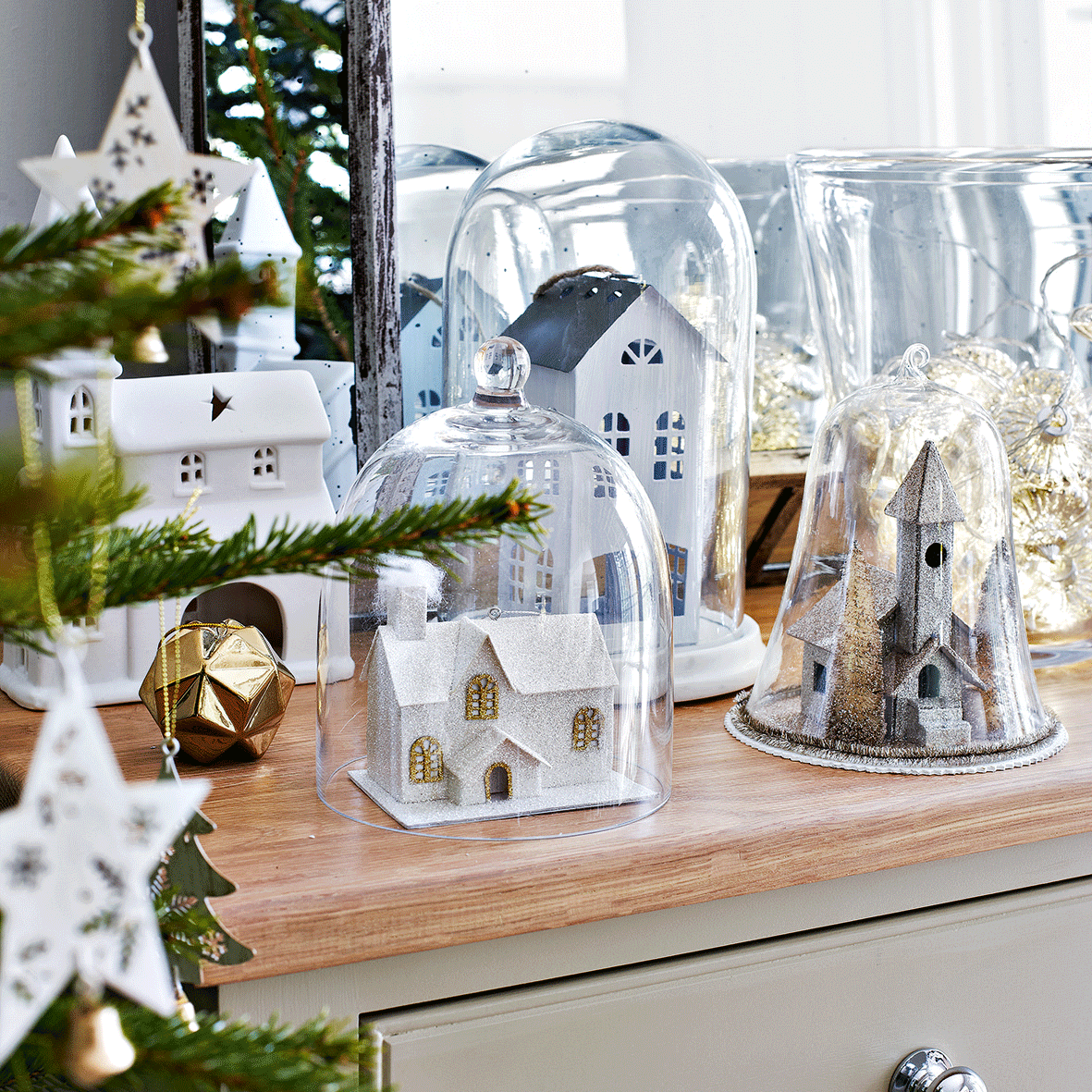mirror and christmas gifts on table