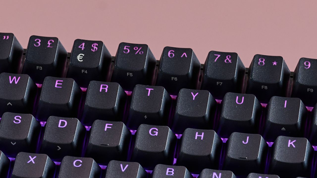 Close-up of number keys on SteelSeries Apex Pro Mini, with pink background