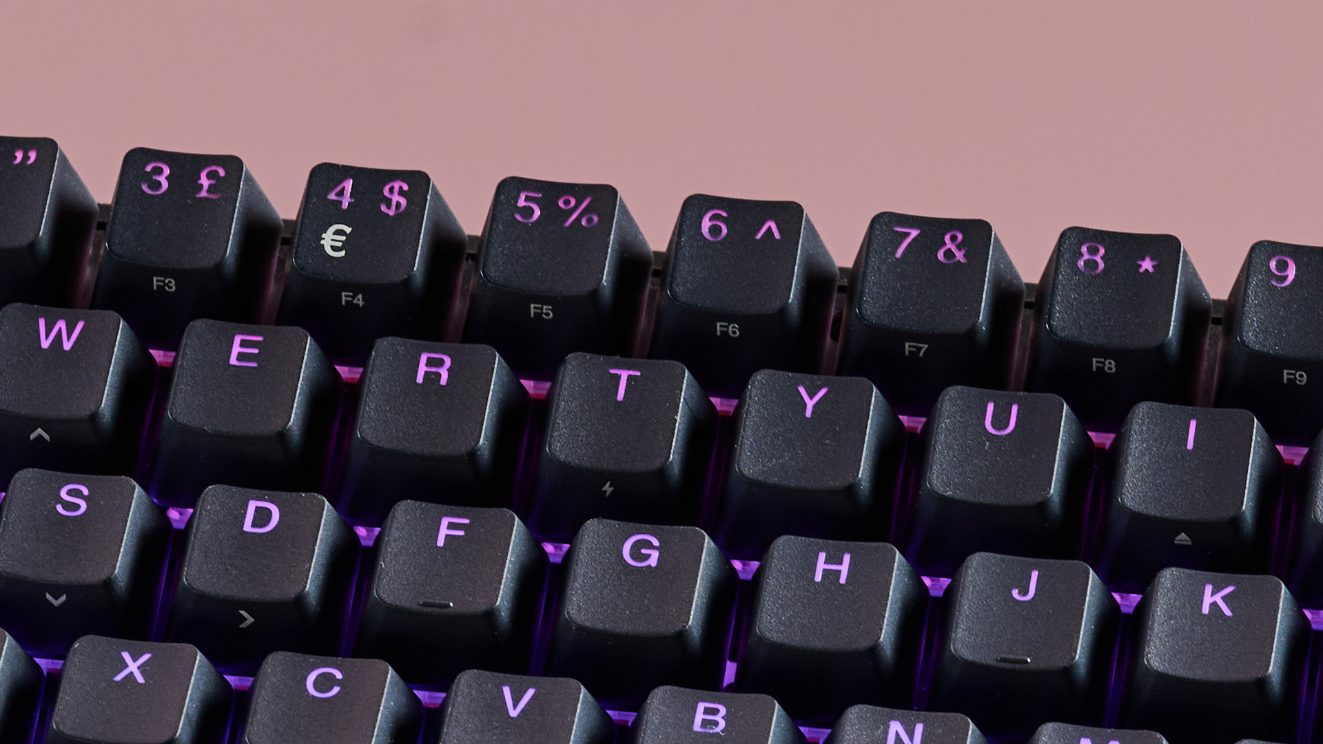 Close-up of number keys on SteelSeries Apex Pro Mini, with pink background