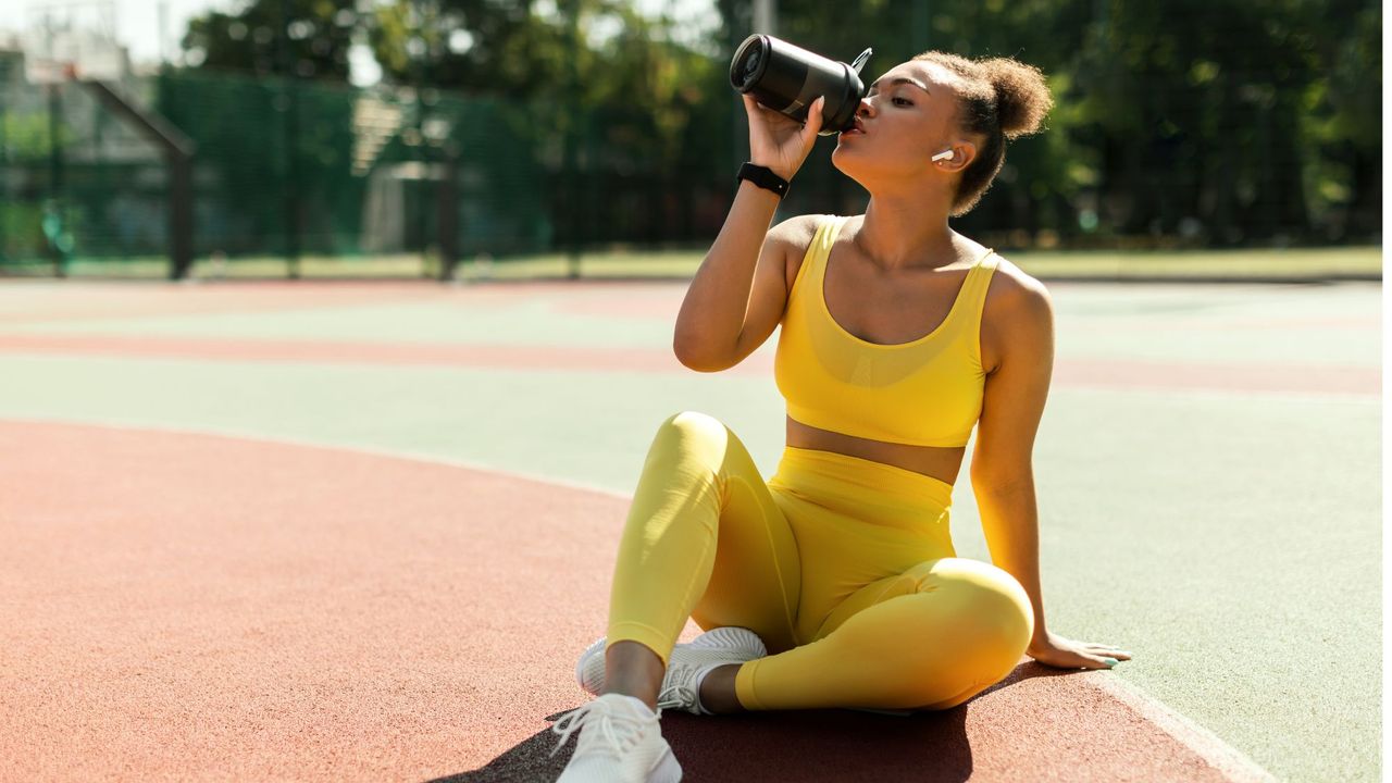 Creatine benefits: A woman drinking a shake