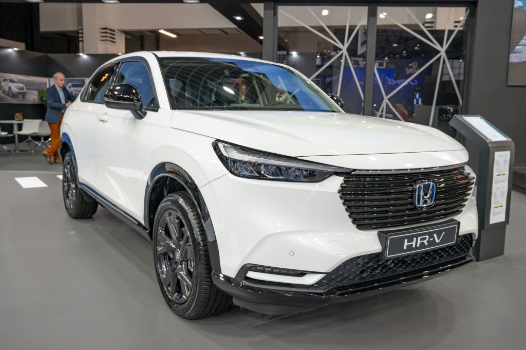 A white Honda HR-V in a showroom.