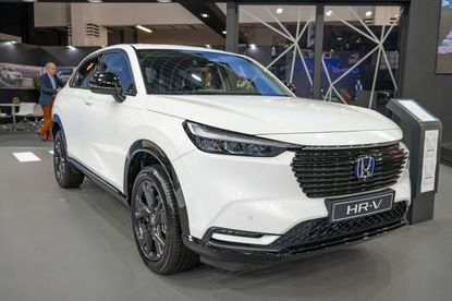 A white Honday HR-V in a showroom.